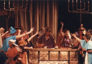 Photo of actors and singers on the stagem fully costumed, in Norwich Opera’s 1983 production of Mendelssohn’s Elijah, directed by Richard White, Norwich Cathedral. Credit: Claxton Opera